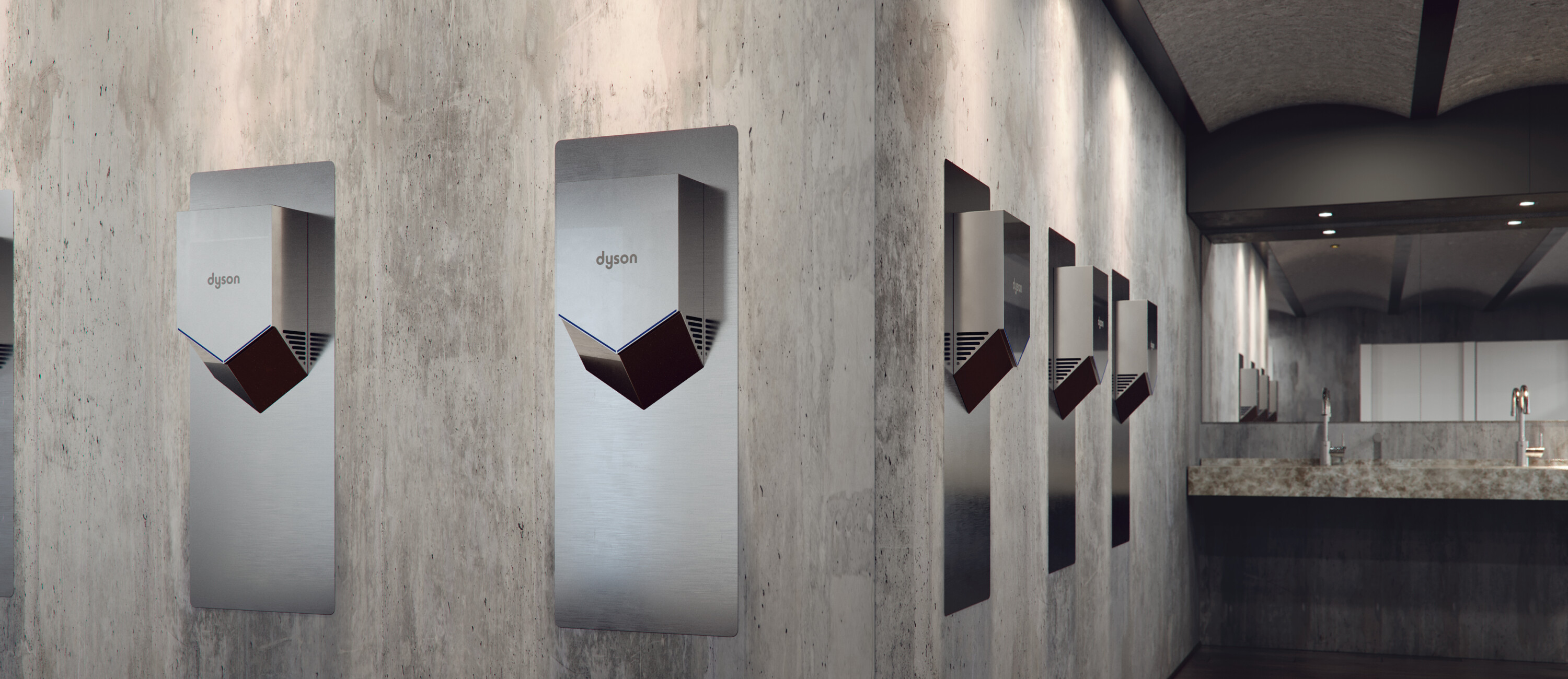5 Dyson Airblade Hand Dryers model HU02 hanging next to each other on a stone wall, in a modern looking washroom.